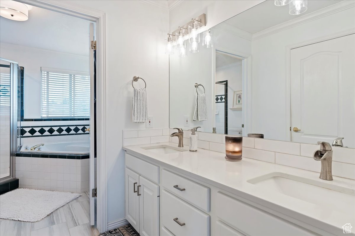 Beautiful master bathroom with double vanity, a jetted tub and a walk-in-shower