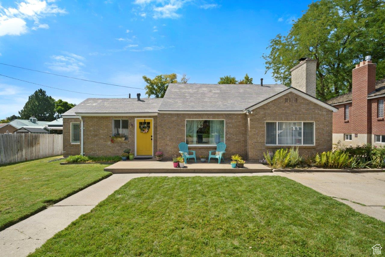 View of front of property with a front lawn