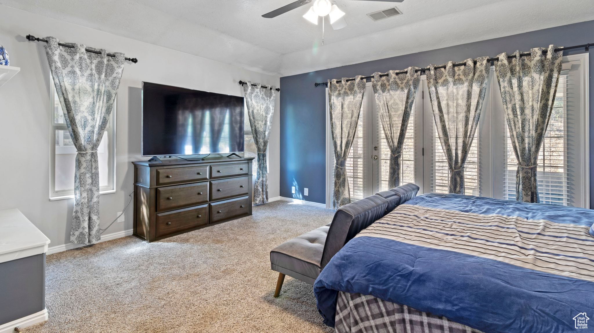 Bedroom with carpet flooring and ceiling fan