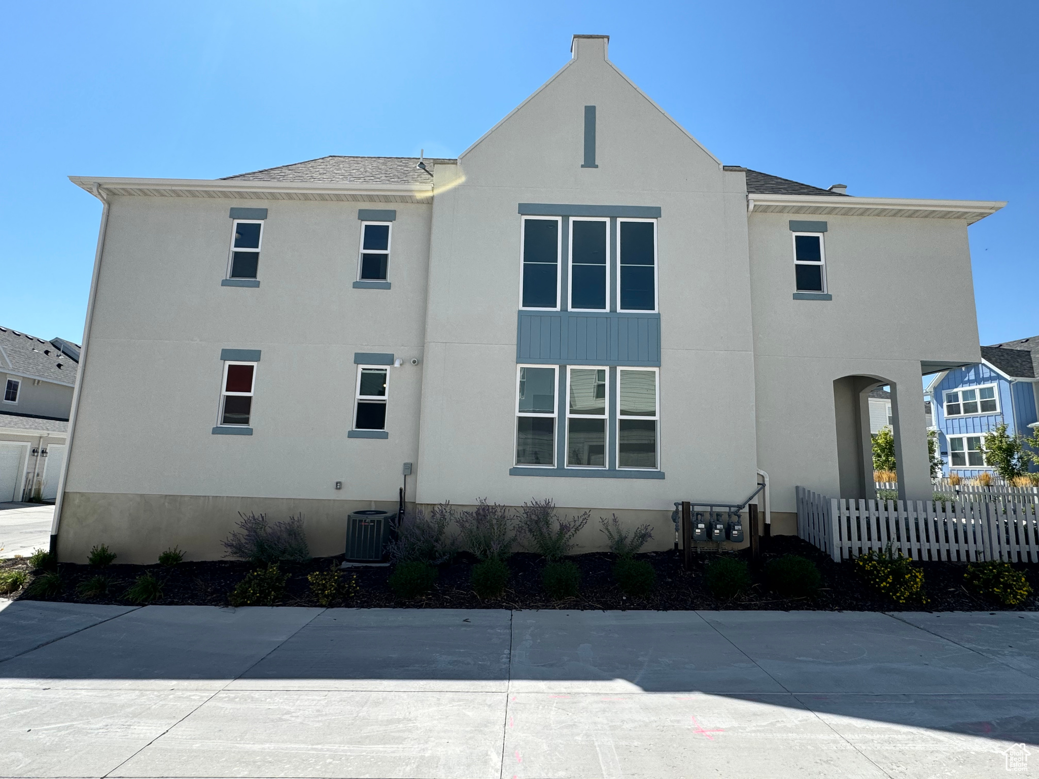 View of side of home featuring central AC