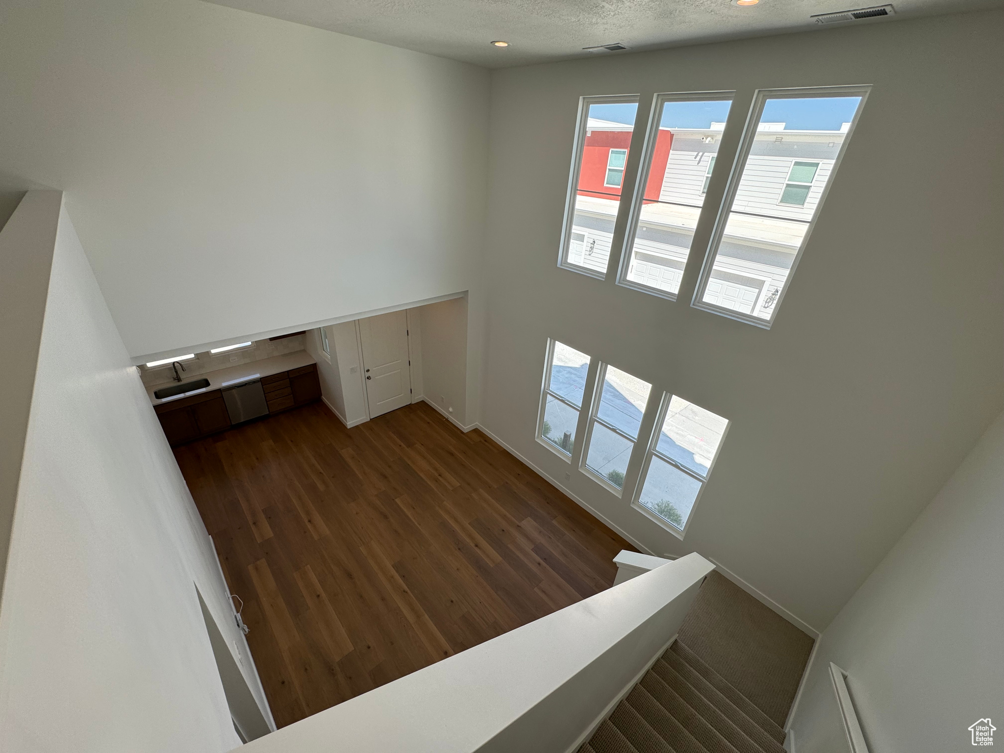 Interior space featuring hardwood / wood-style flooring, a textured ceiling, and plenty of natural light