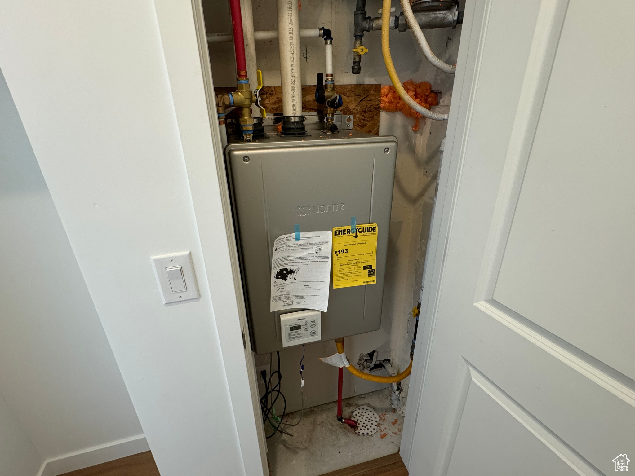 Utility room with tankless water heater