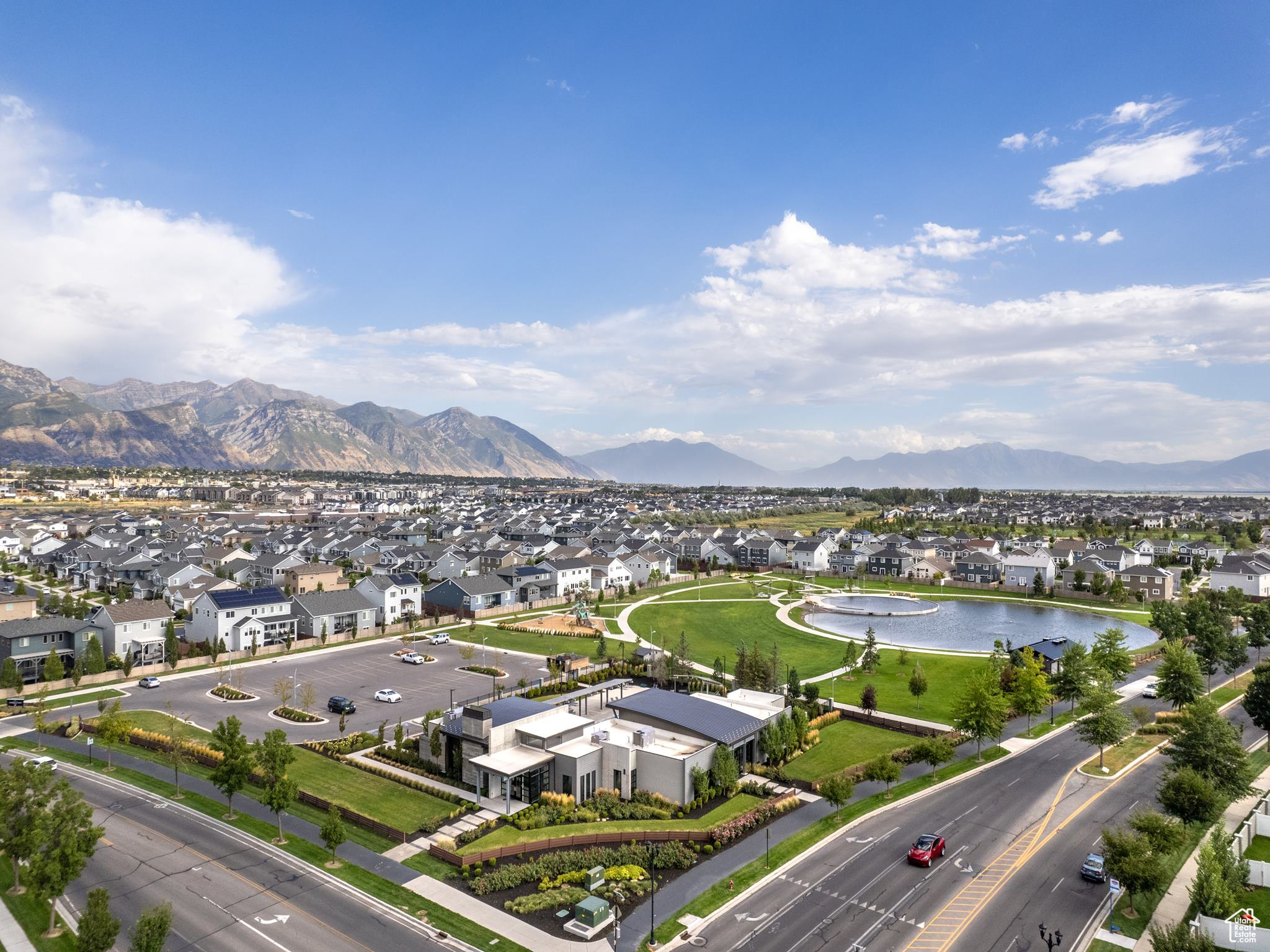 Drone / aerial view featuring a water and mountain view