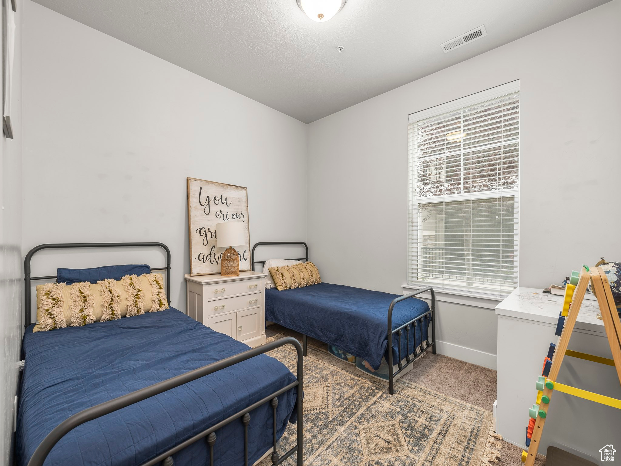 View of carpeted bedroom