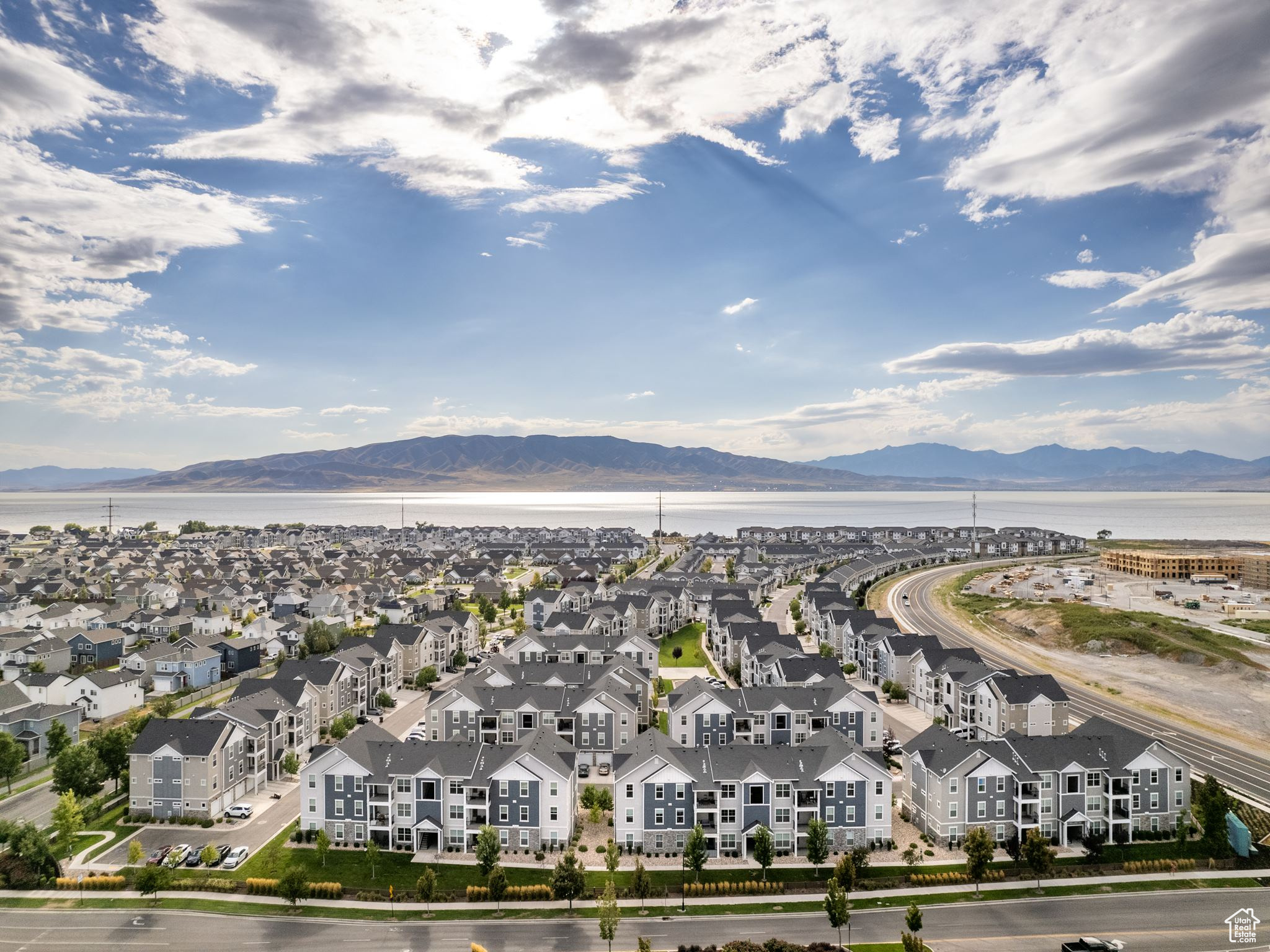 Birds eye view of property with a water and mountain view