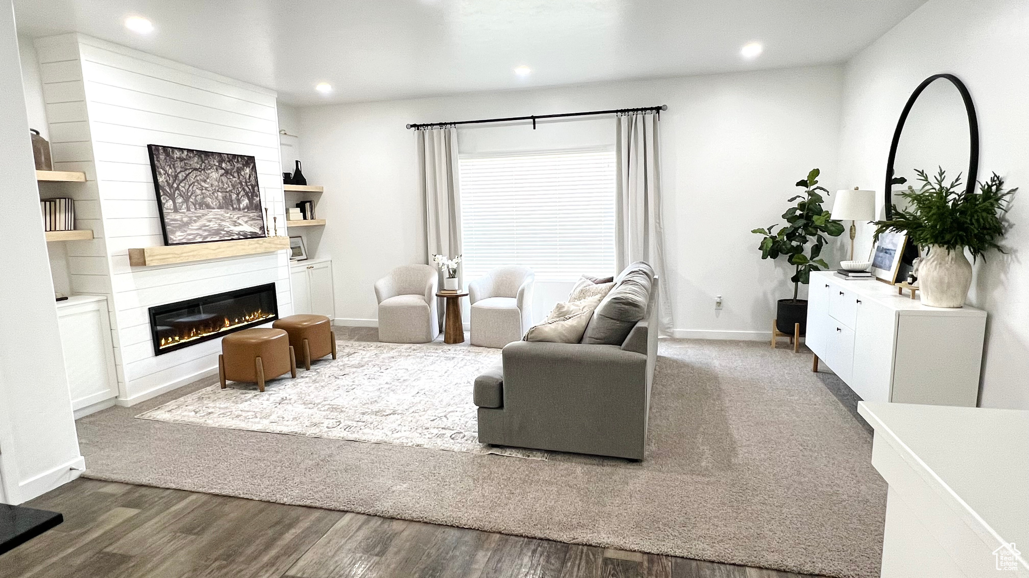 Living room featuring a fireplace and dark hardwood / wood-style flooring