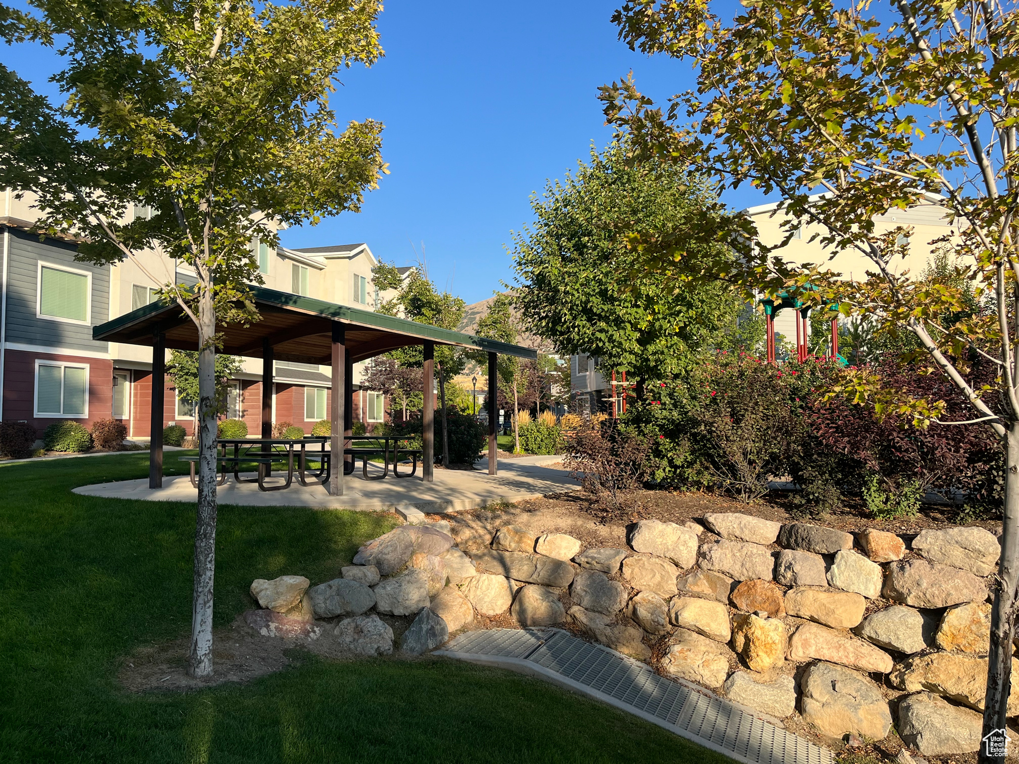 View of rock wall and pergola