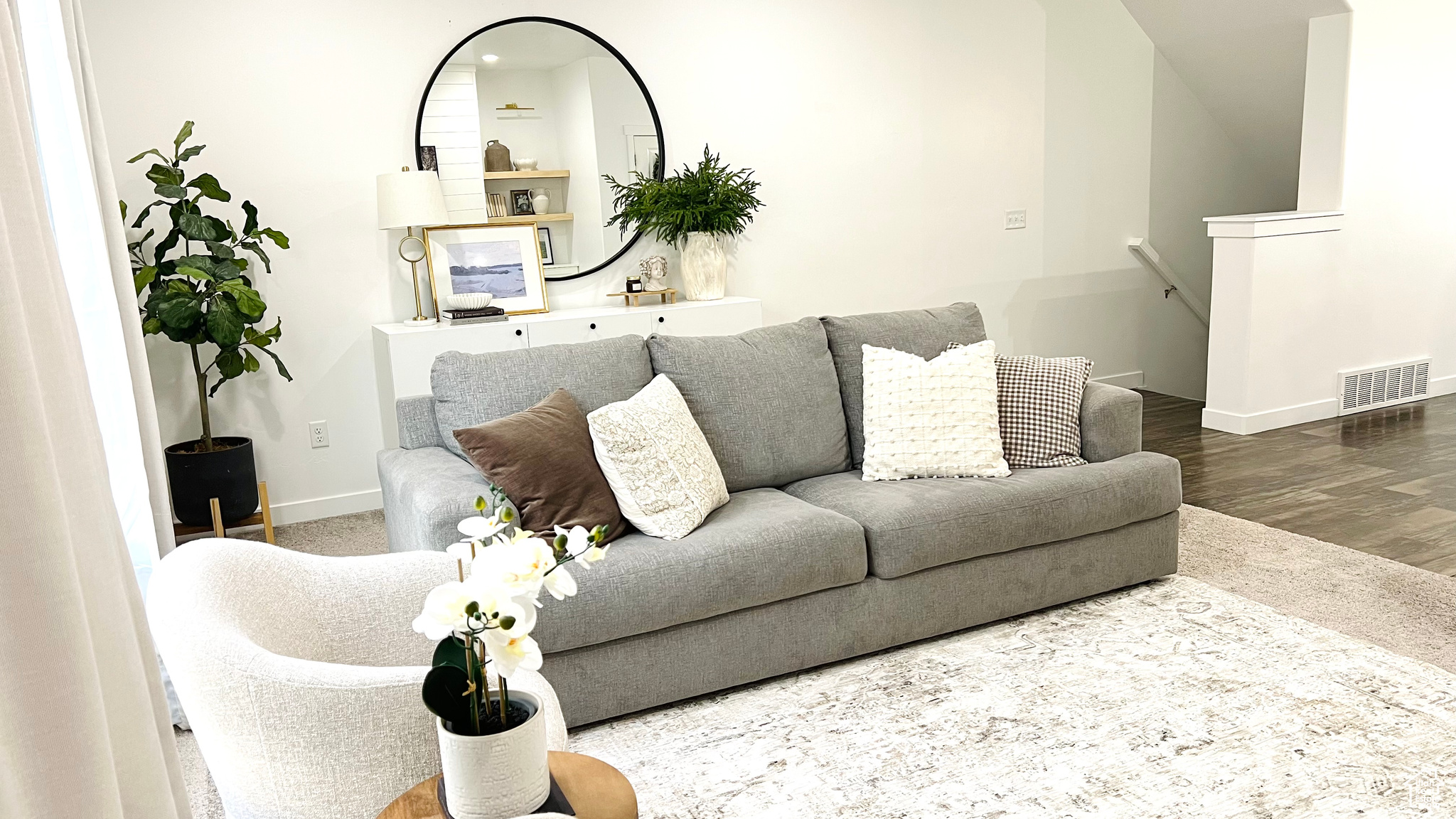 Living room with hardwood / wood-style flooring