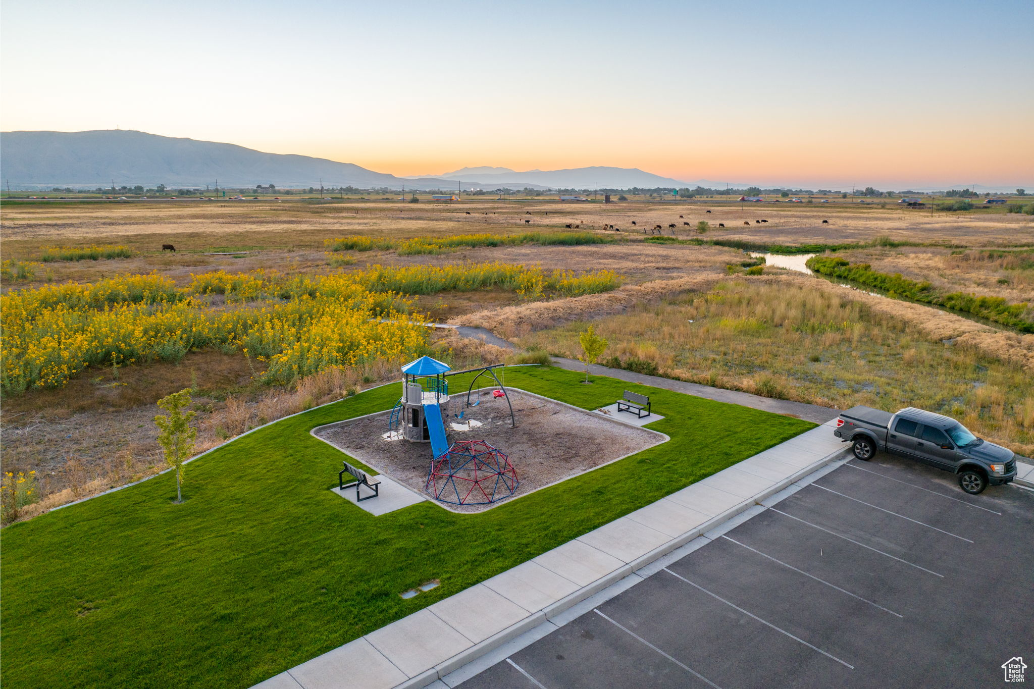 Aerial view at dusk featuring a mountain view