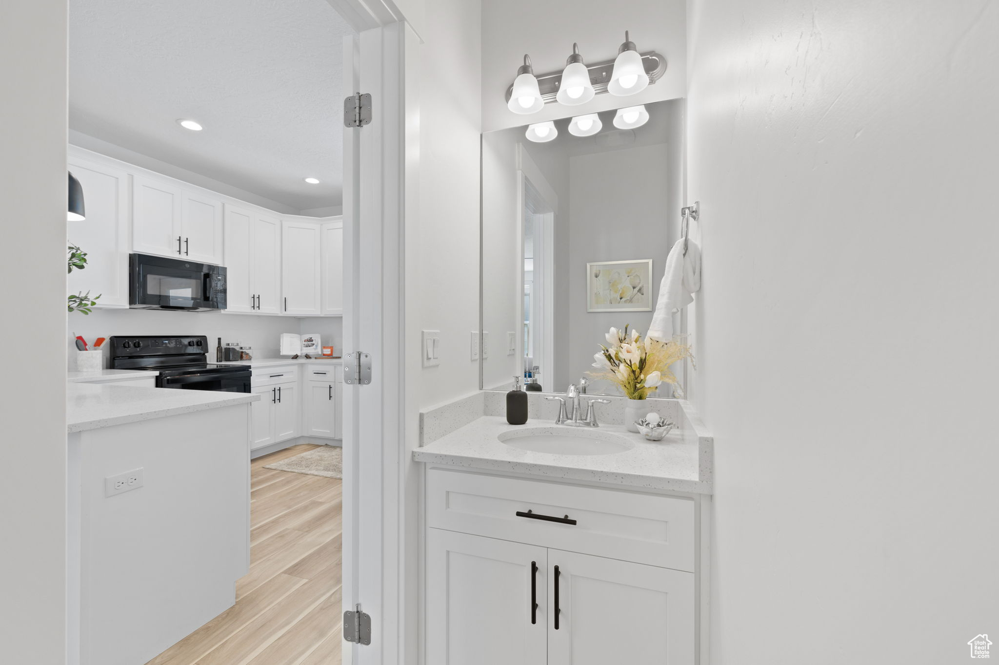 Bathroom featuring vanity and hardwood / wood-style flooring