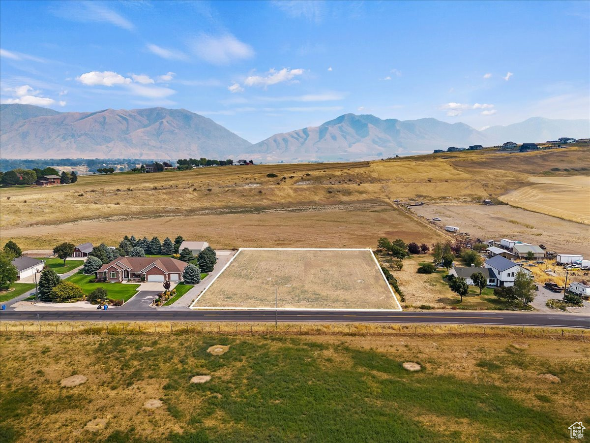 Drone / aerial view with a mountain view and a rural view