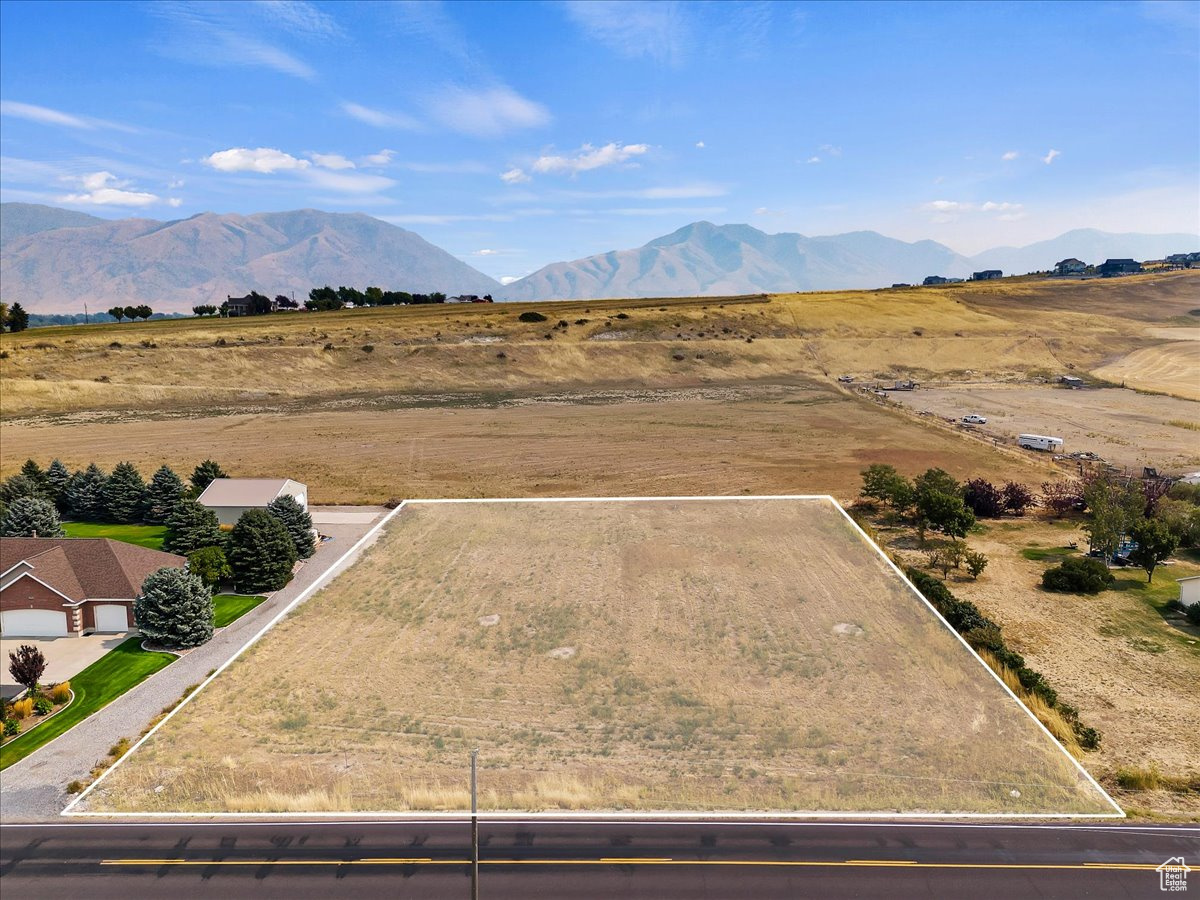 Birds eye view of property featuring a mountain view and a rural view