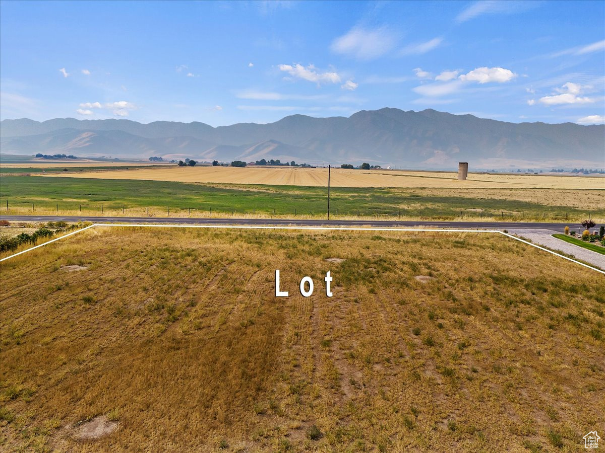 Property view of mountains with a rural view