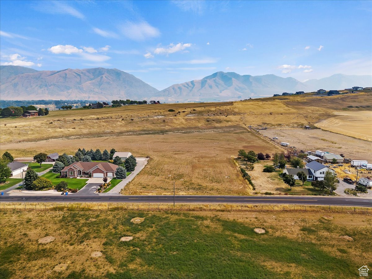 Drone / aerial view with a mountain view and a rural view