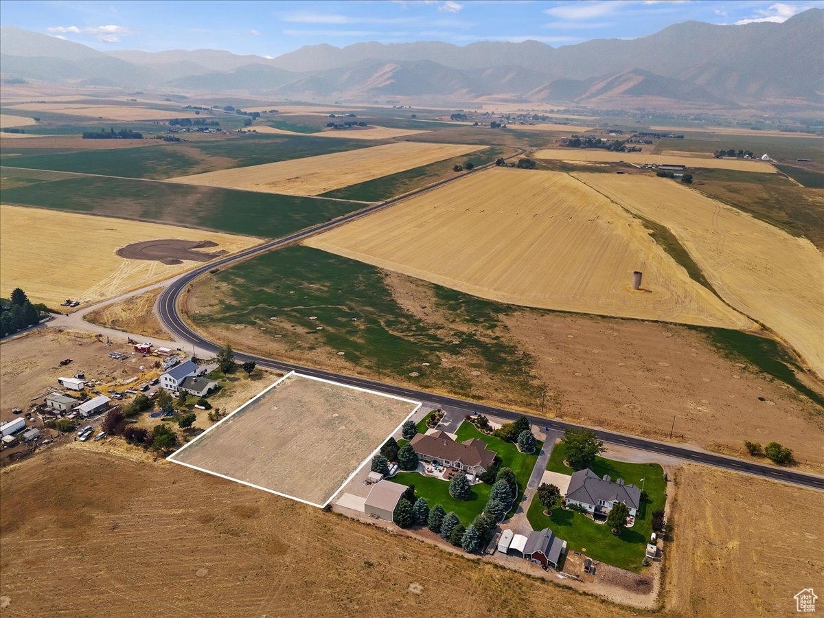 Birds eye view of property featuring a mountain view and a rural view