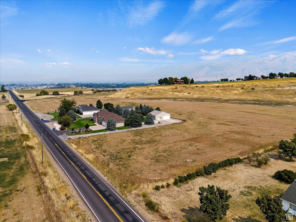 Birds eye view of property with a rural view