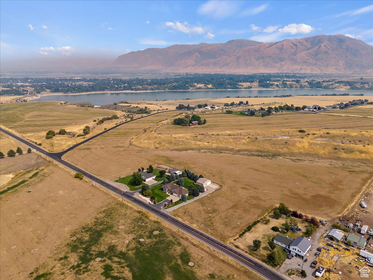 Aerial view with a water and mountain view and a rural view