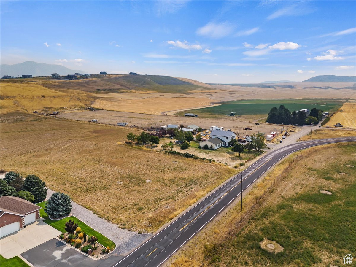 Birds eye view of property with a mountain view and a rural view