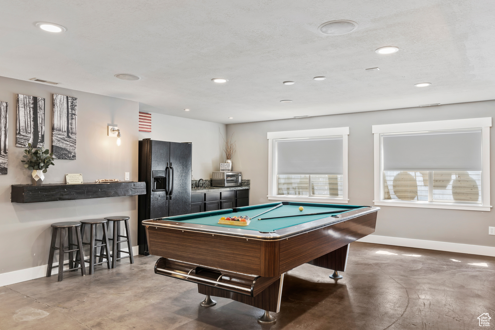 Playroom featuring concrete floors, pool table, and sink