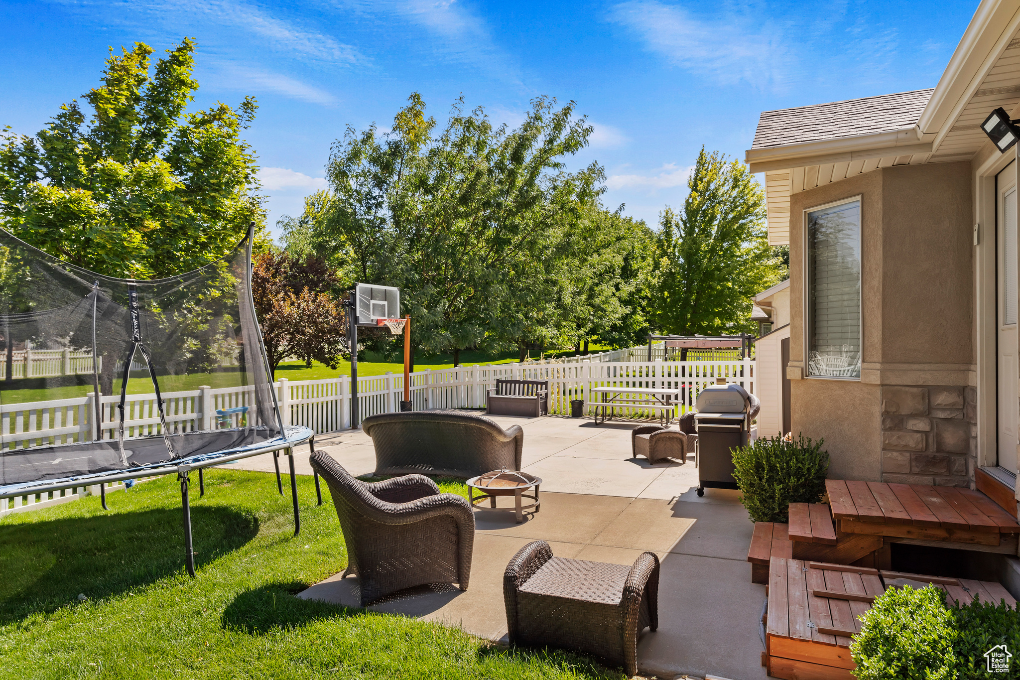 View of patio / terrace with a trampoline and grilling area