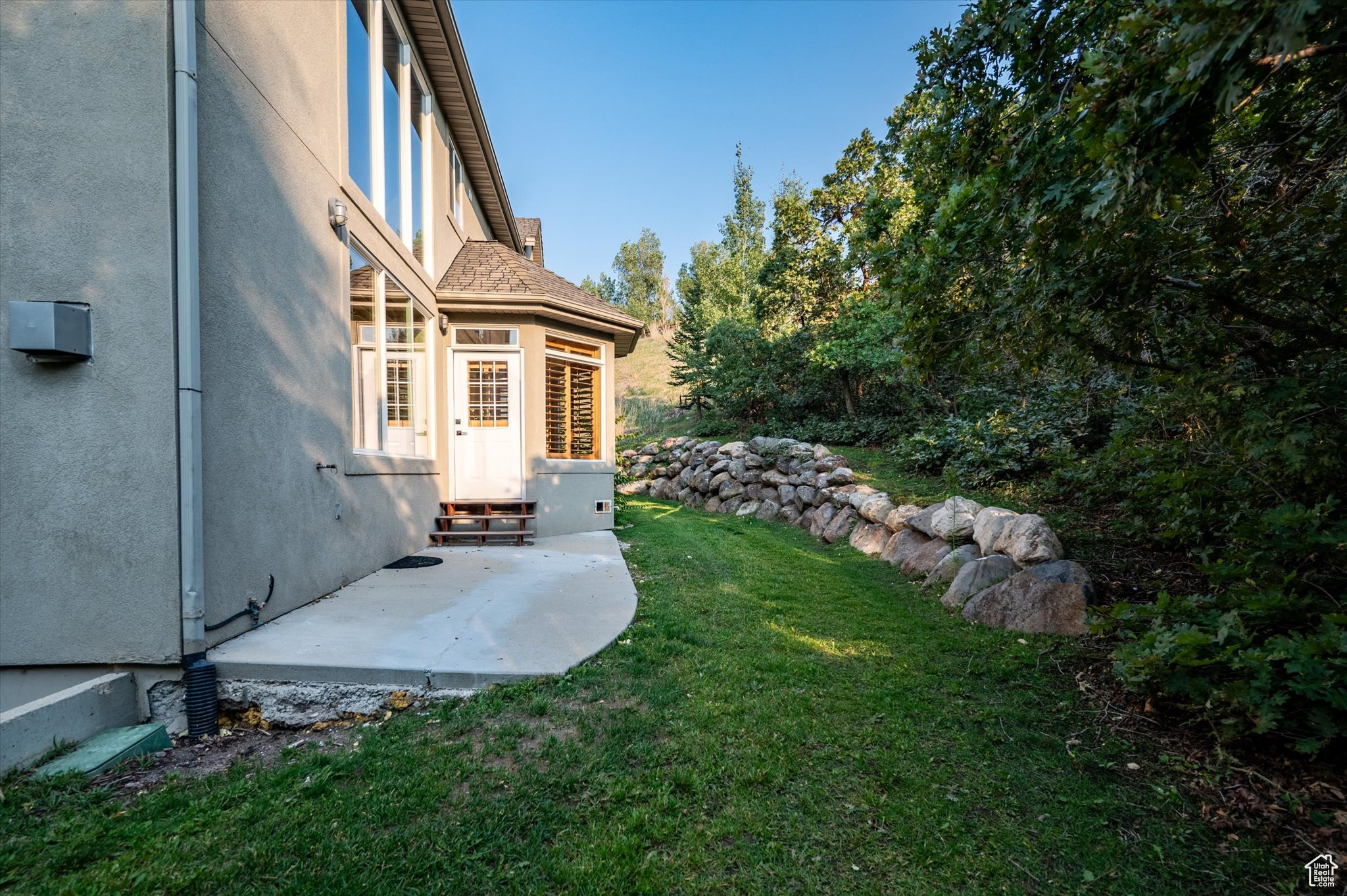 View of yard with a patio