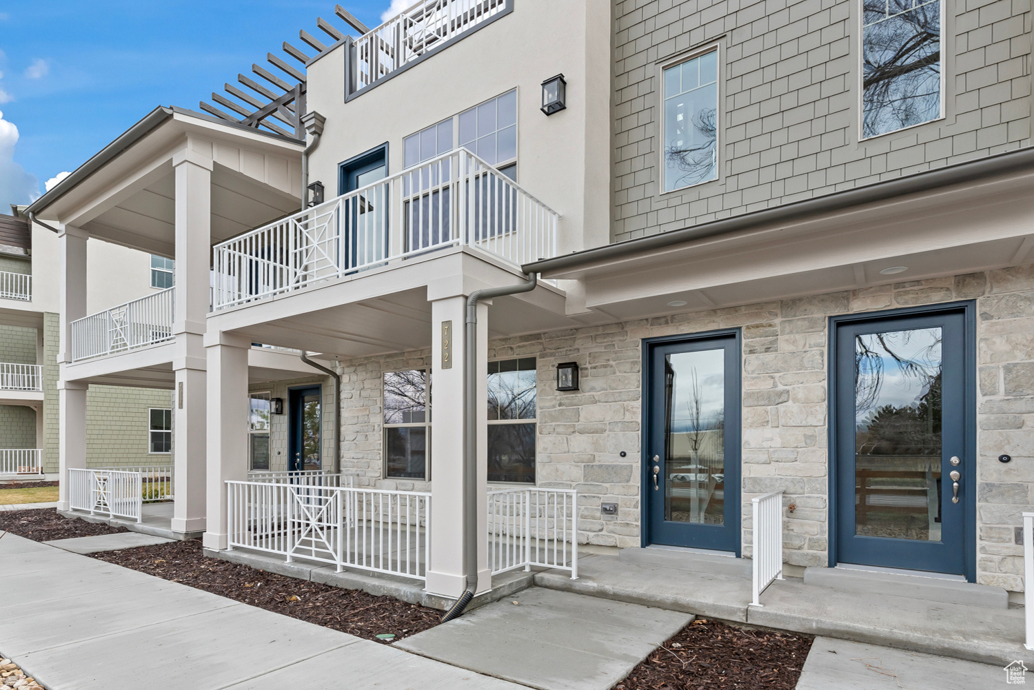 Exterior space with a balcony and a porch