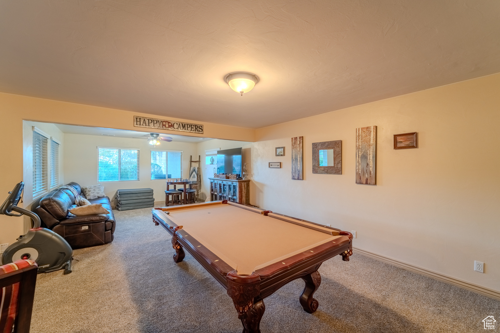 Game room with pool table, carpet, and ceiling fan