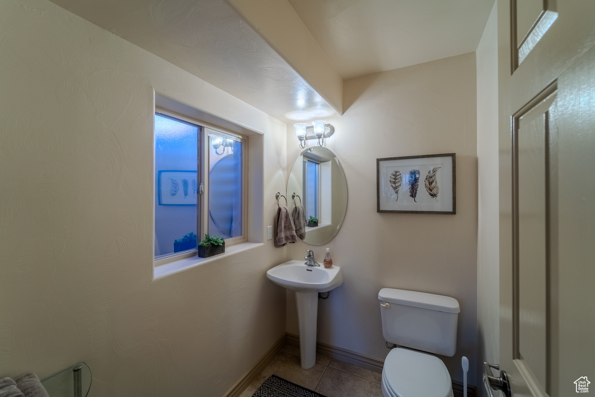 Bathroom with tile patterned flooring and toilet