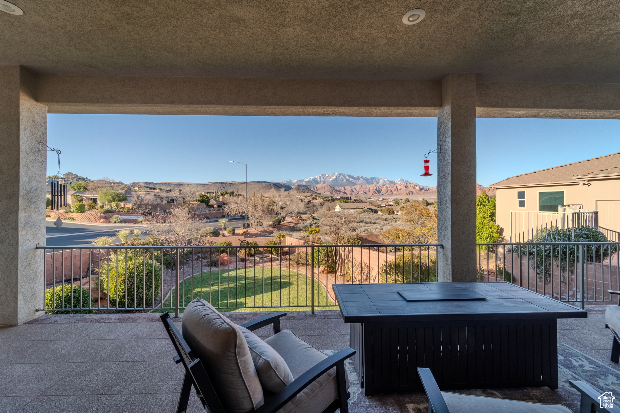 View of patio featuring a balcony and a mountain view