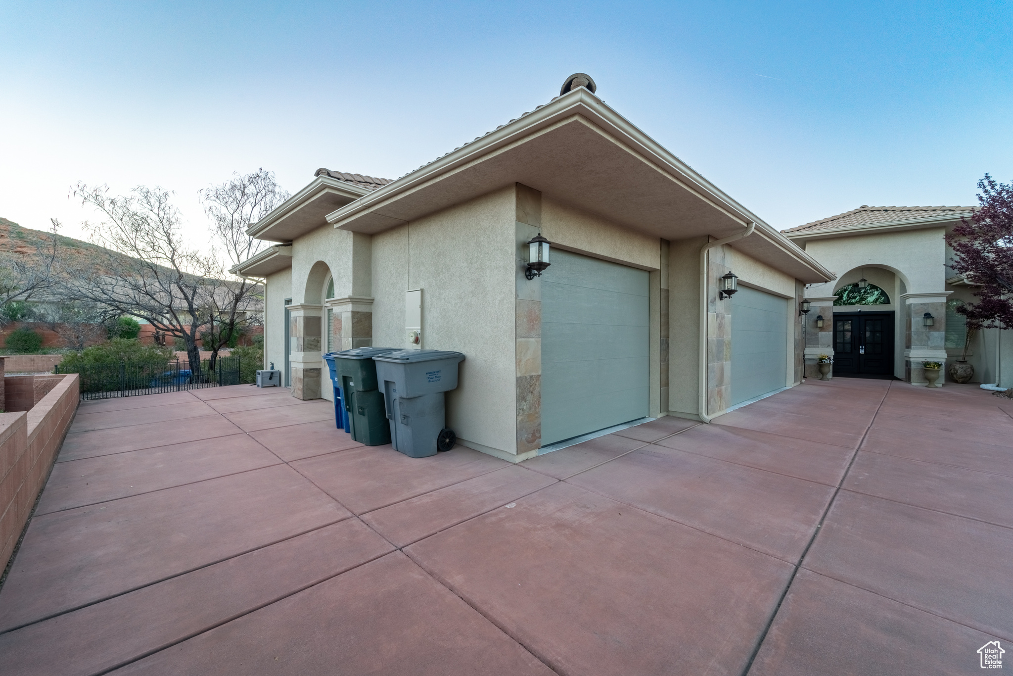 View of side of home featuring a garage