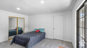 Bedroom featuring a closet and light colored carpet