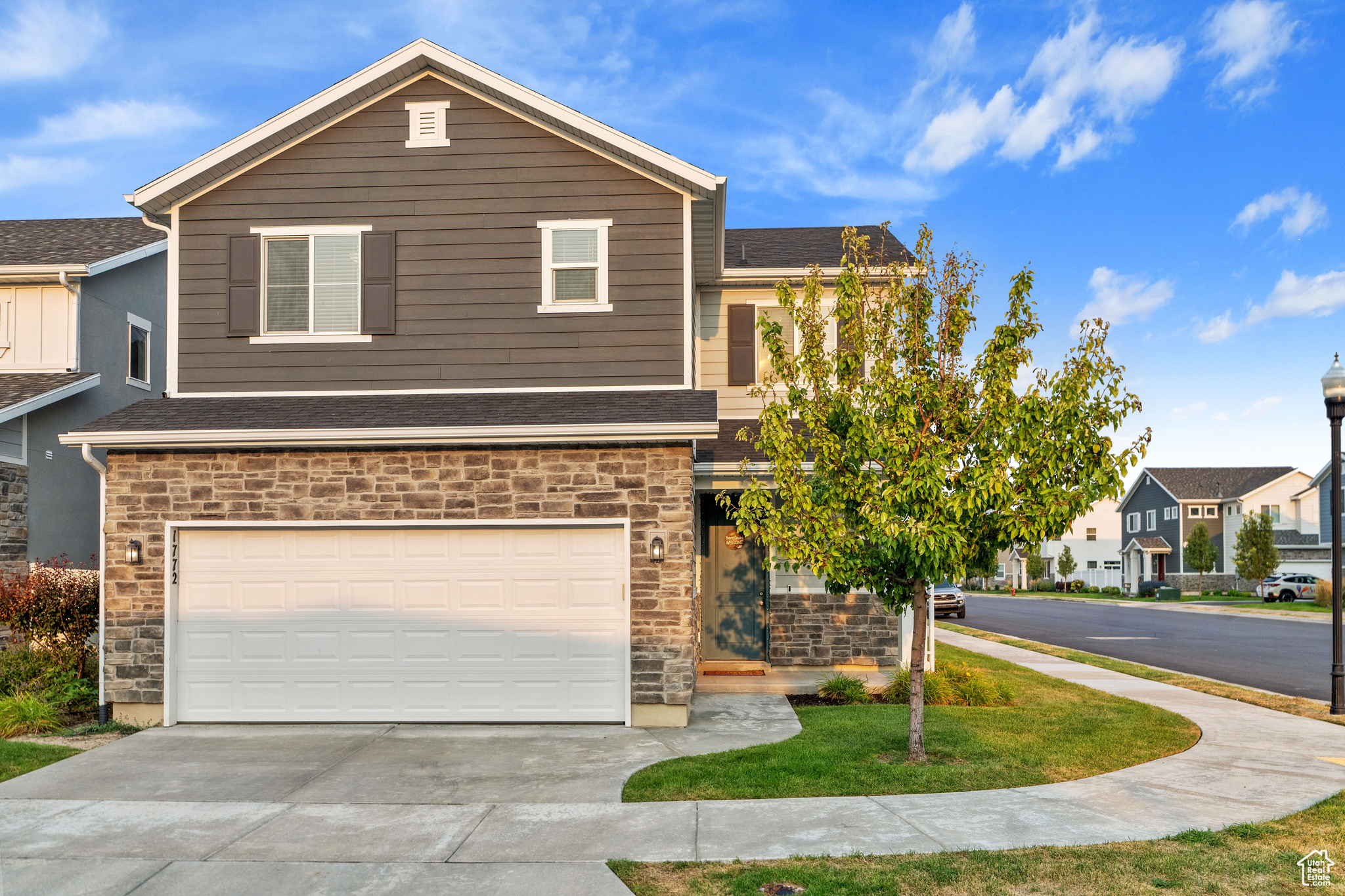 View of front of property featuring a garage