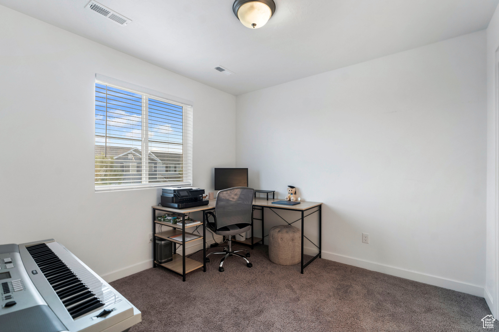 Office area with dark carpet