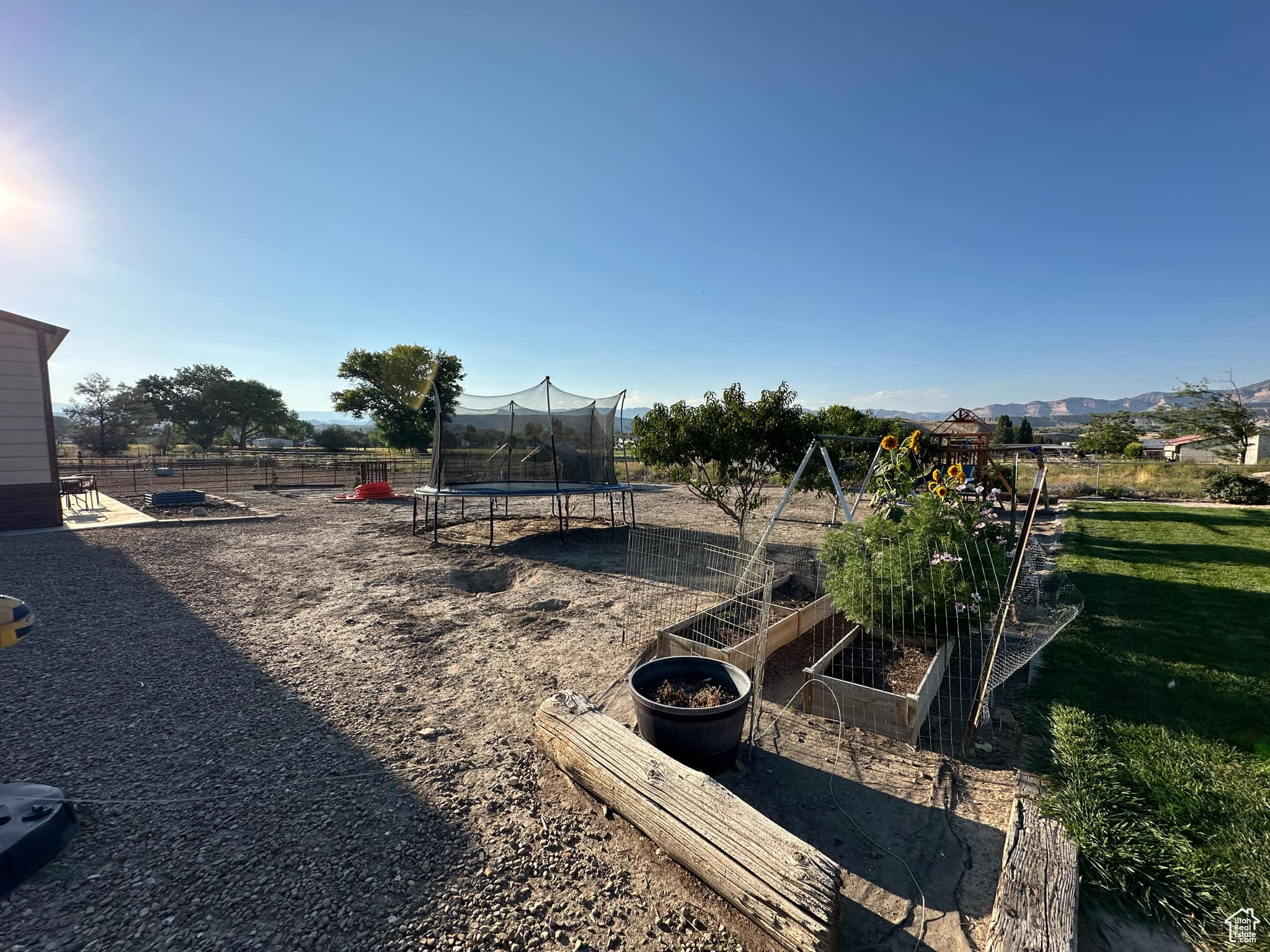 View of yard featuring a trampoline