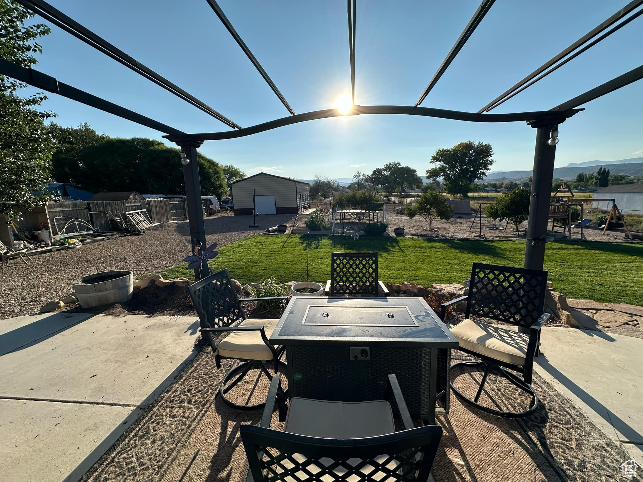 View of patio / terrace featuring a playground and a shed