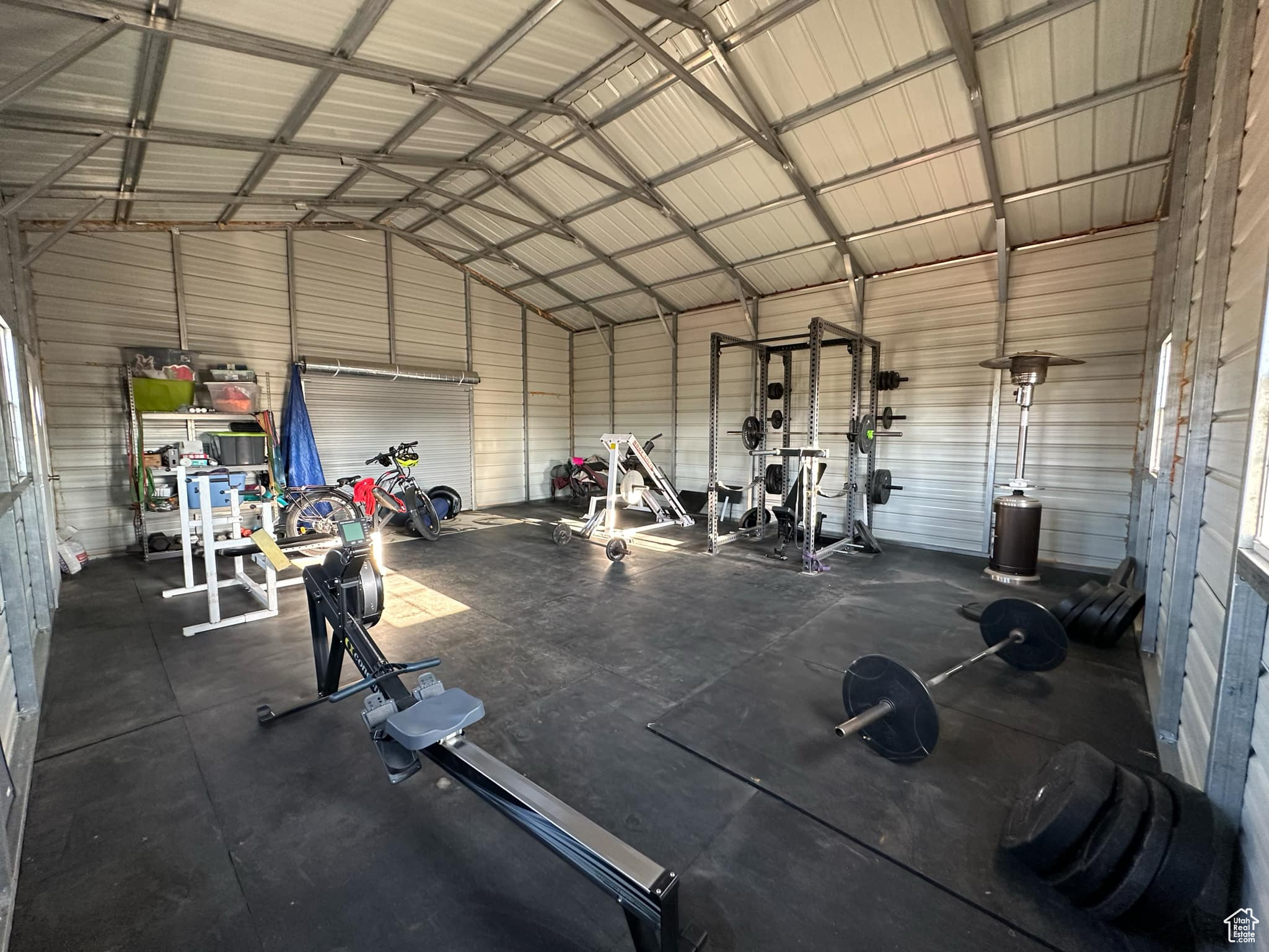 Gym featuring vaulted ceiling