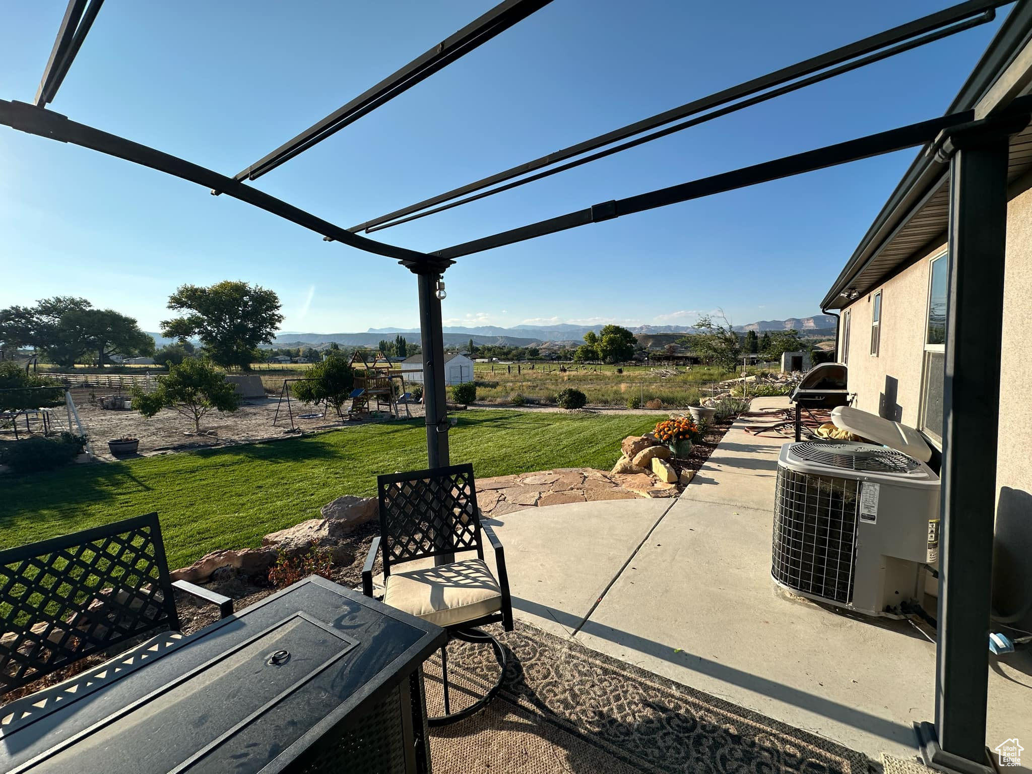 View of patio / terrace featuring a pergola and central air condition unit