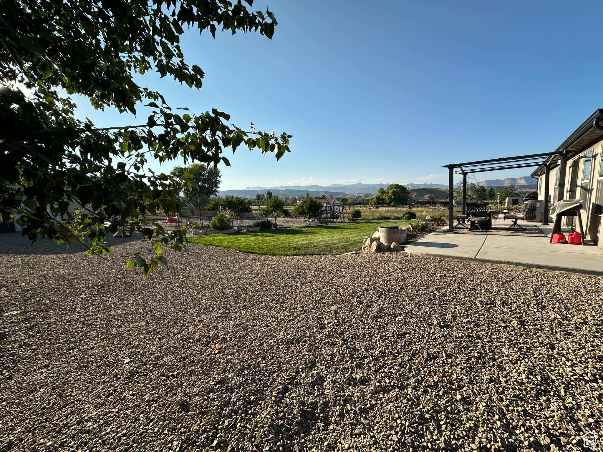 View of yard with a mountain view and a patio