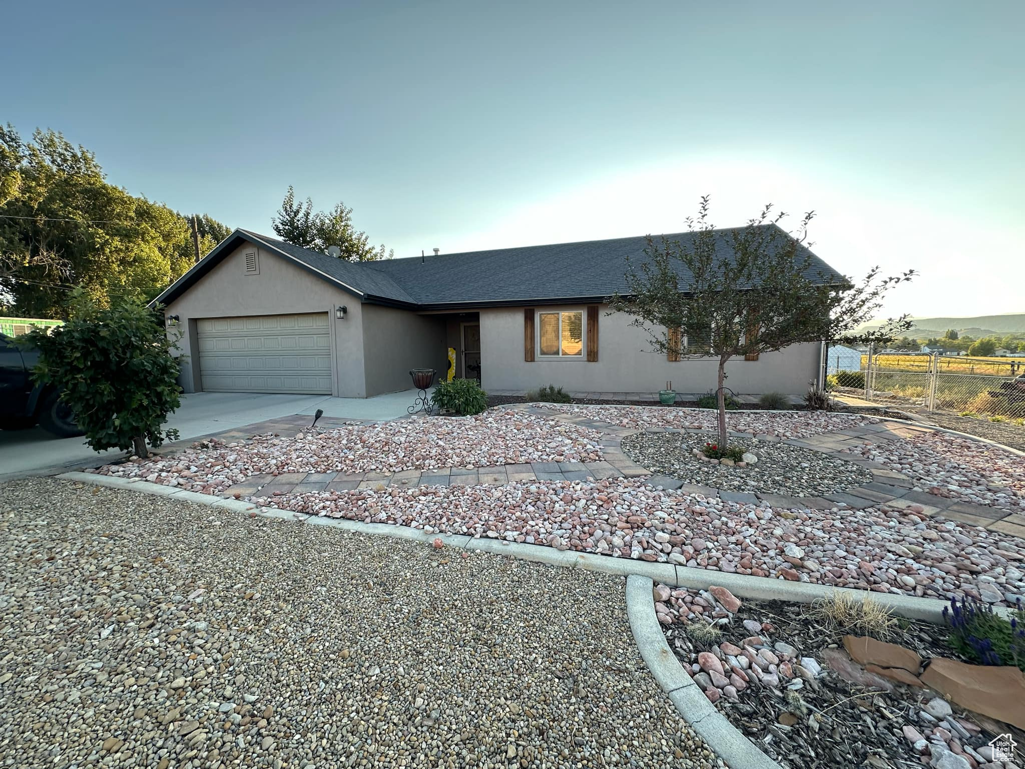 Ranch-style house featuring a garage