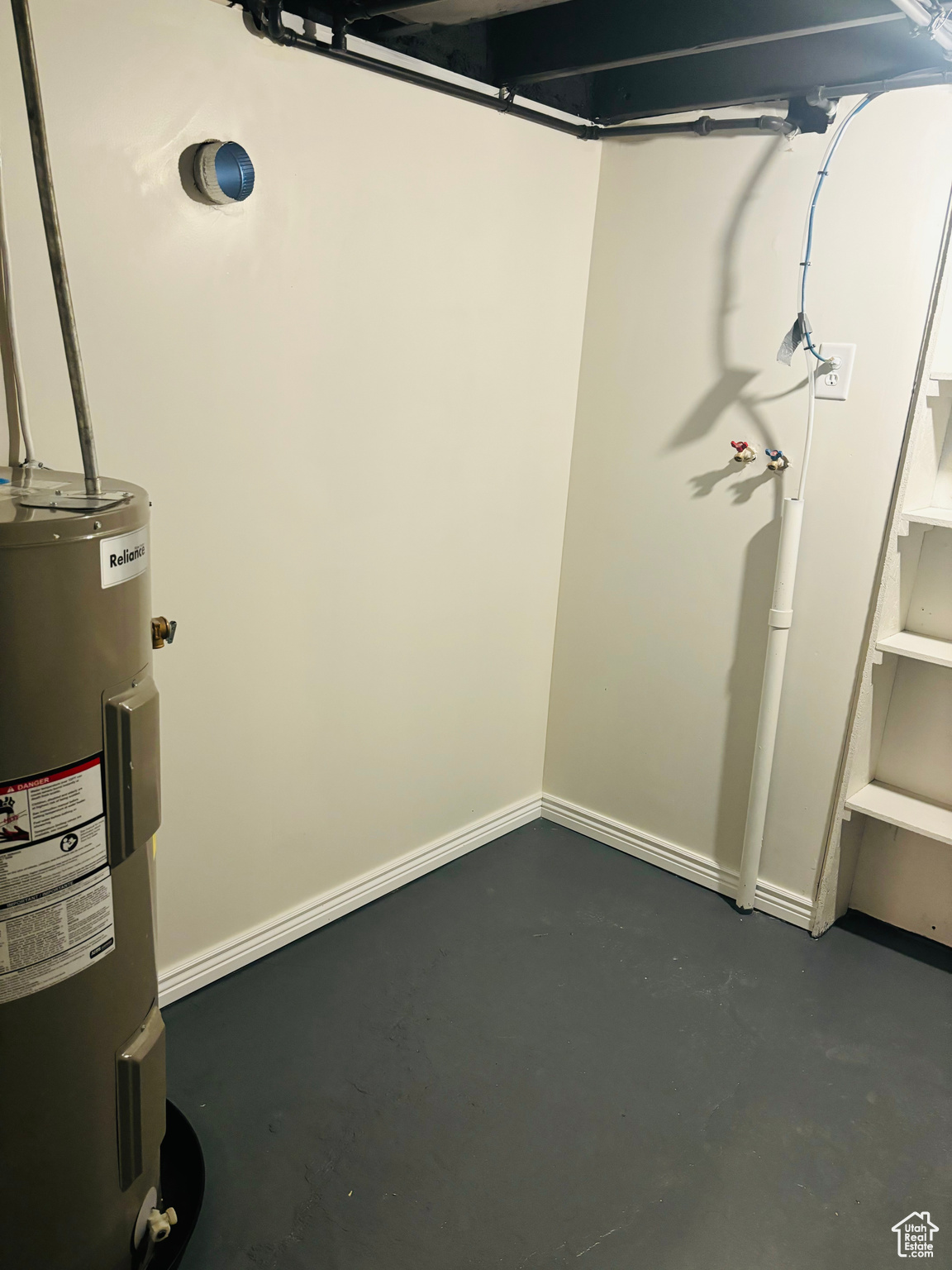 Basement featuring water heater