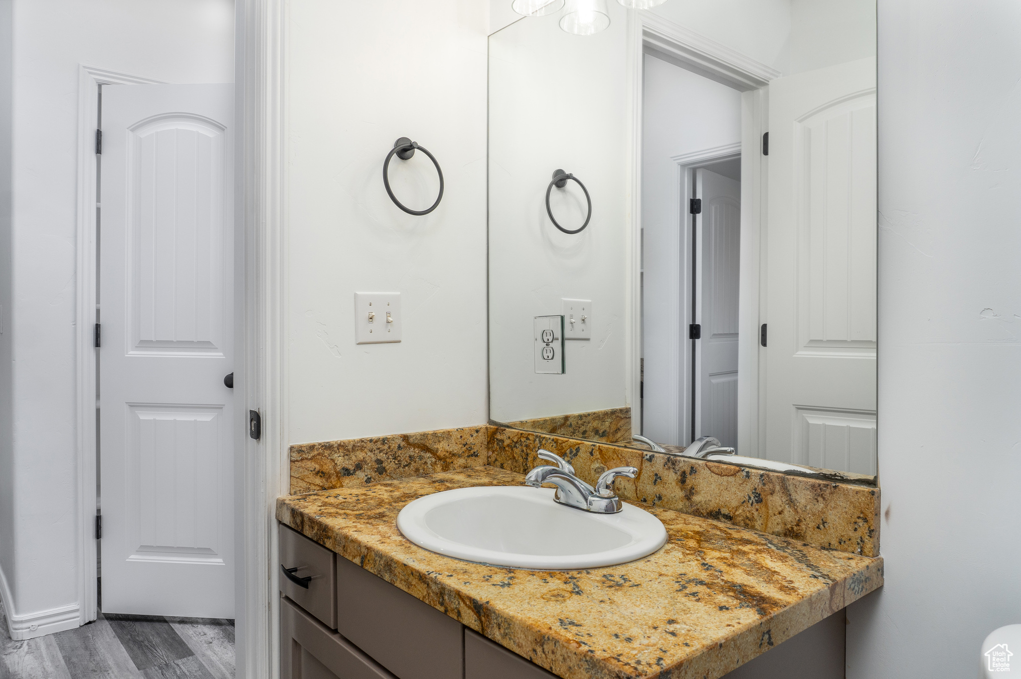 Bathroom with vanity and hardwood / wood-style flooring