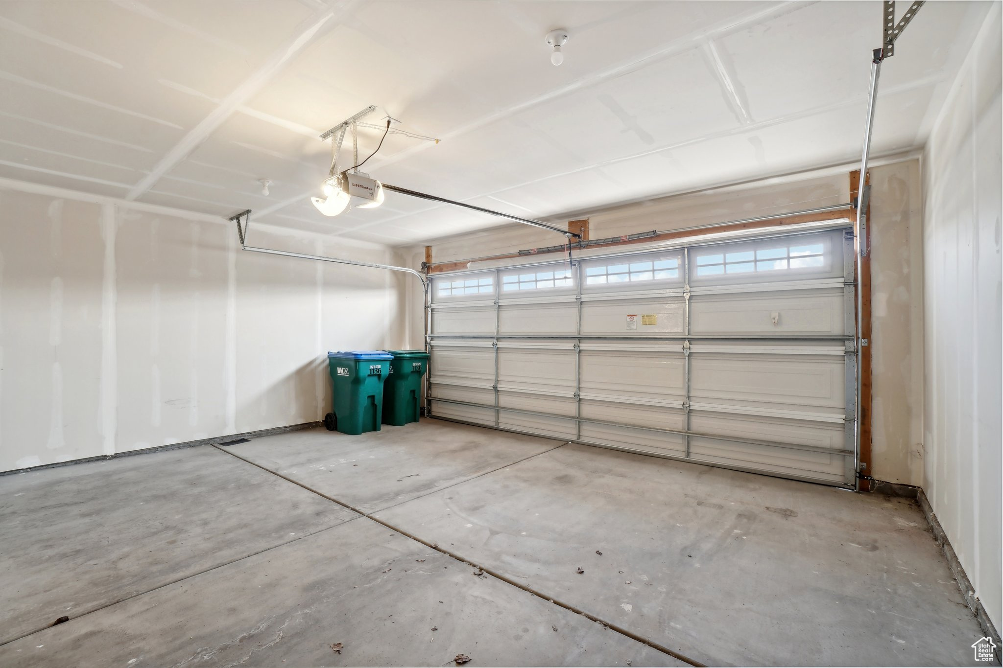 Garage featuring a garage door opener