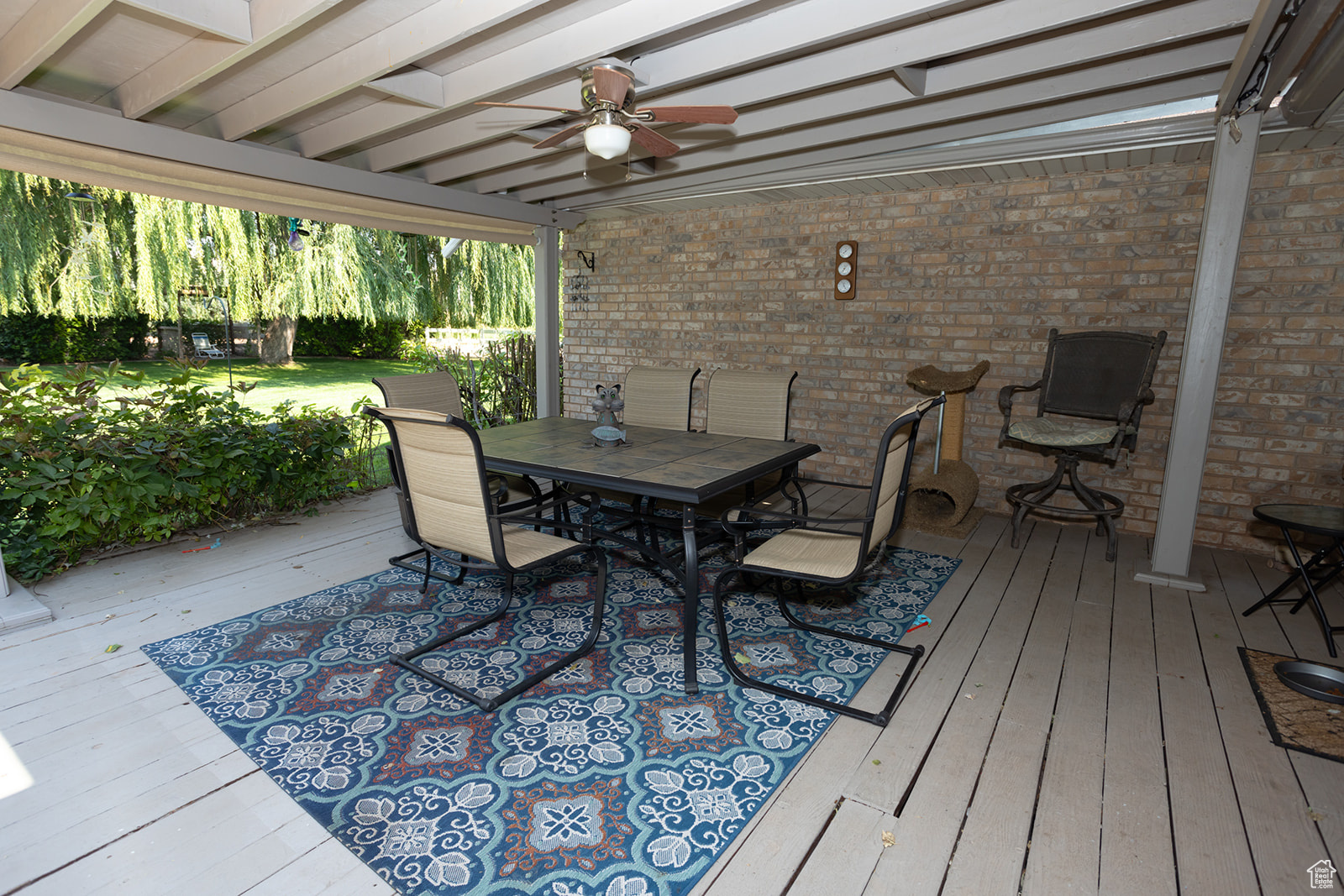 Wooden terrace with ceiling fan