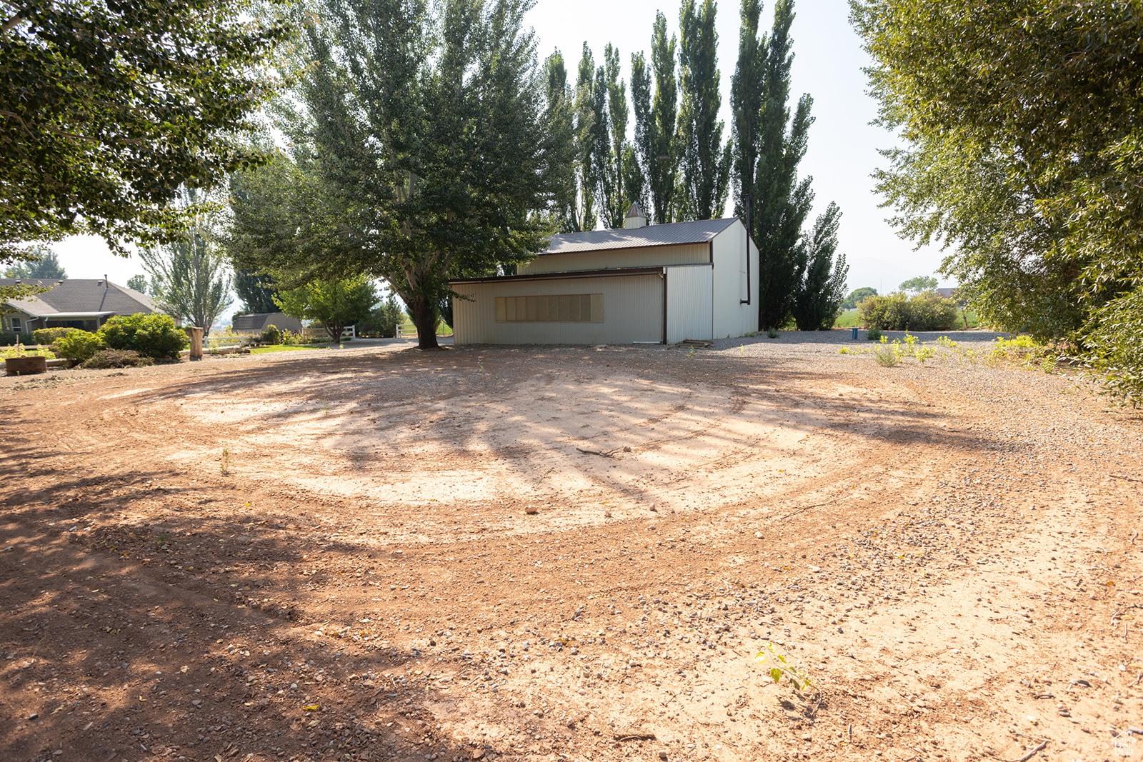 Exterior space with an outbuilding and a garage