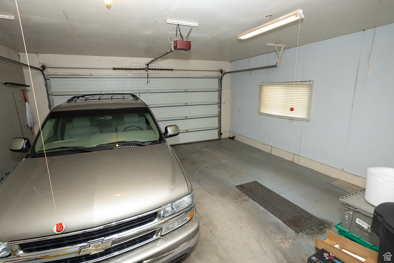 Garage featuring a garage door opener