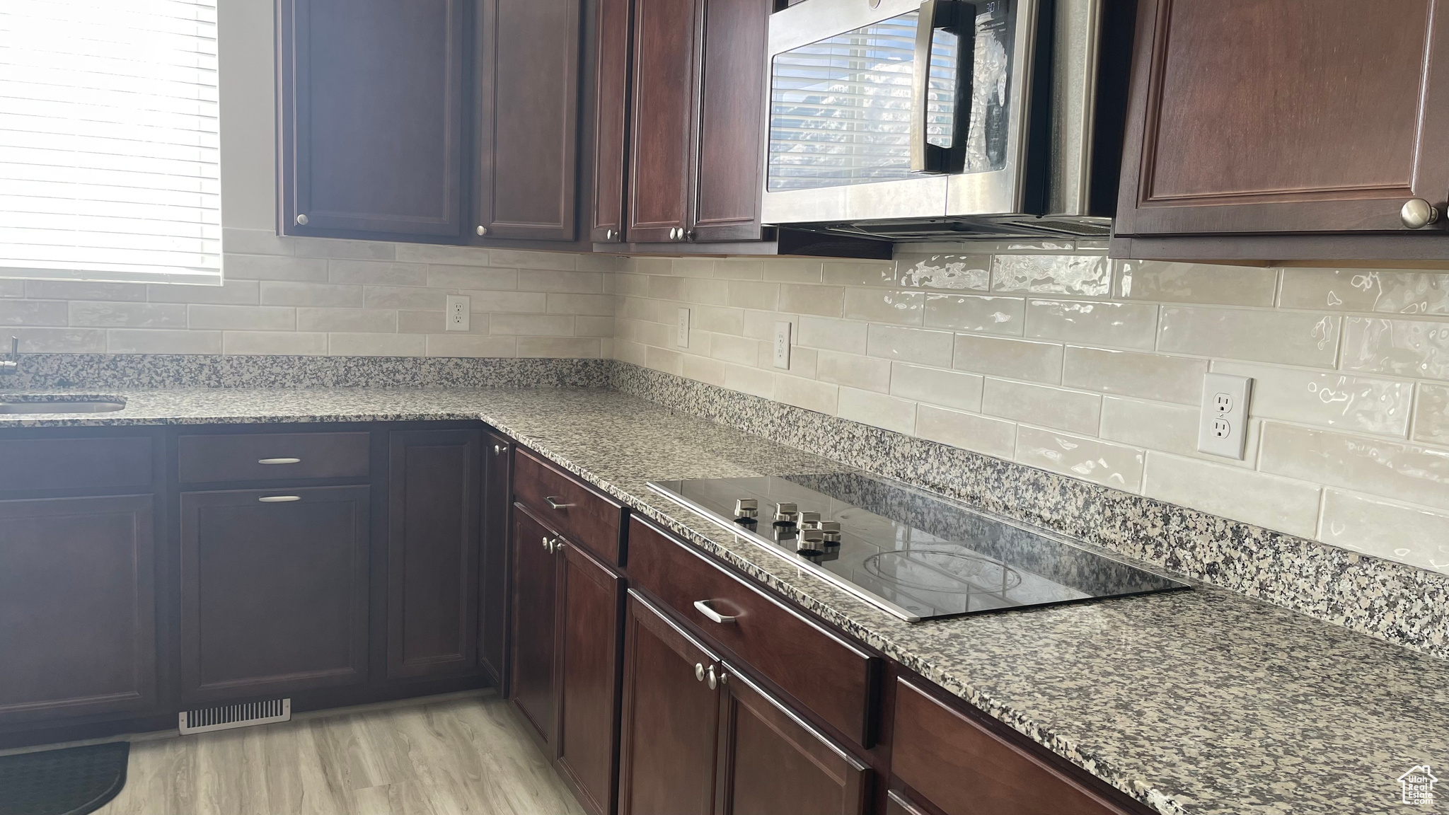 Kitchen with newly installed backsplash