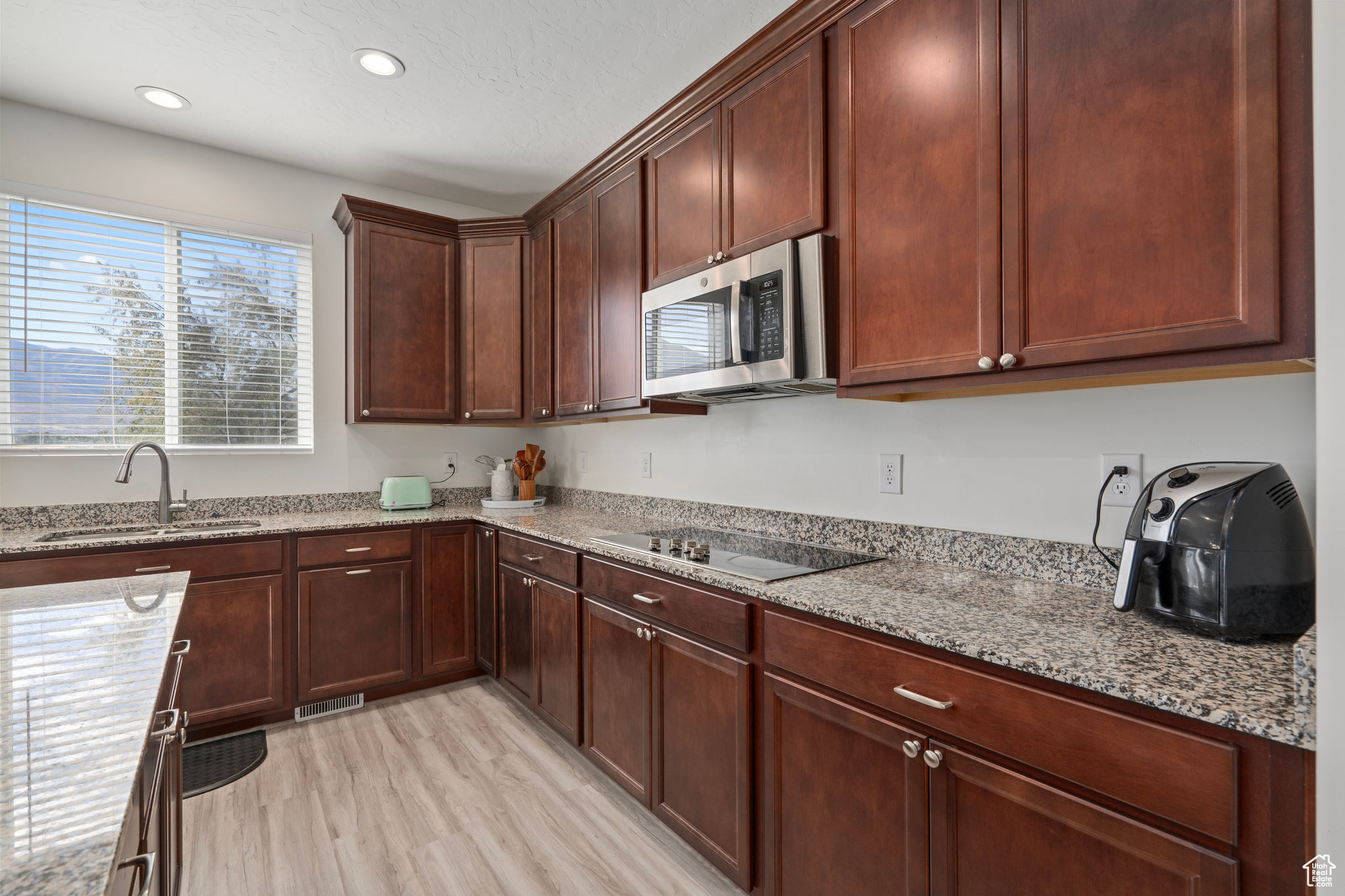 Extra wide space between island and counter , allowing for multiple cooks