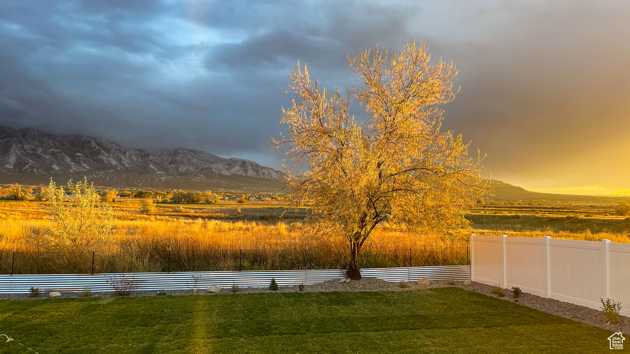 Yard at dusk featuring a mountain view