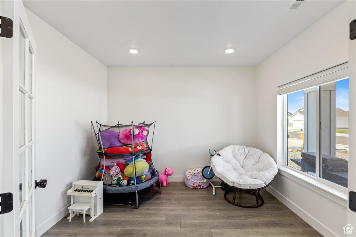 Den/Office with hardwood / wood-style flooring