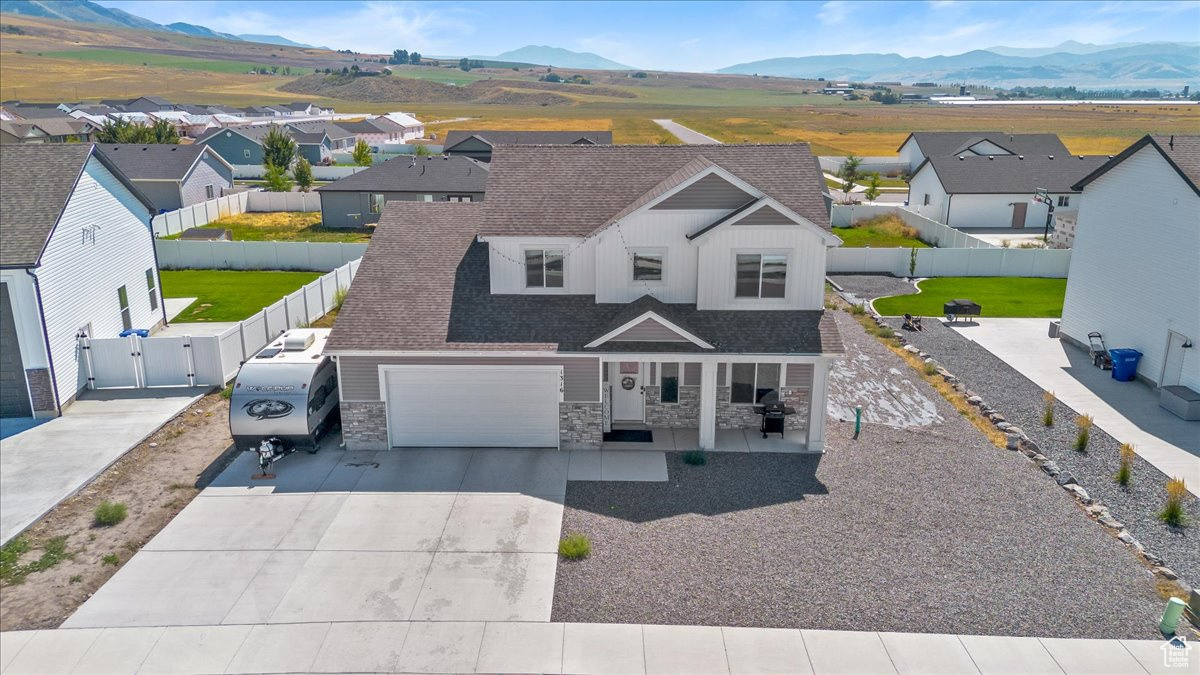 View of front of house featuring a garage and a mountain view